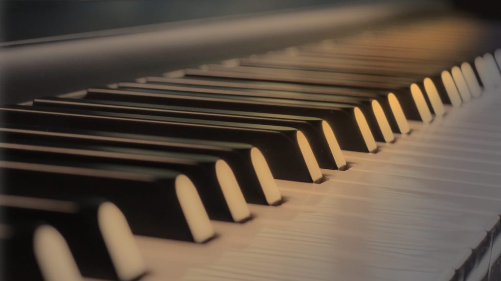 Electric piano with semi-weighted keys