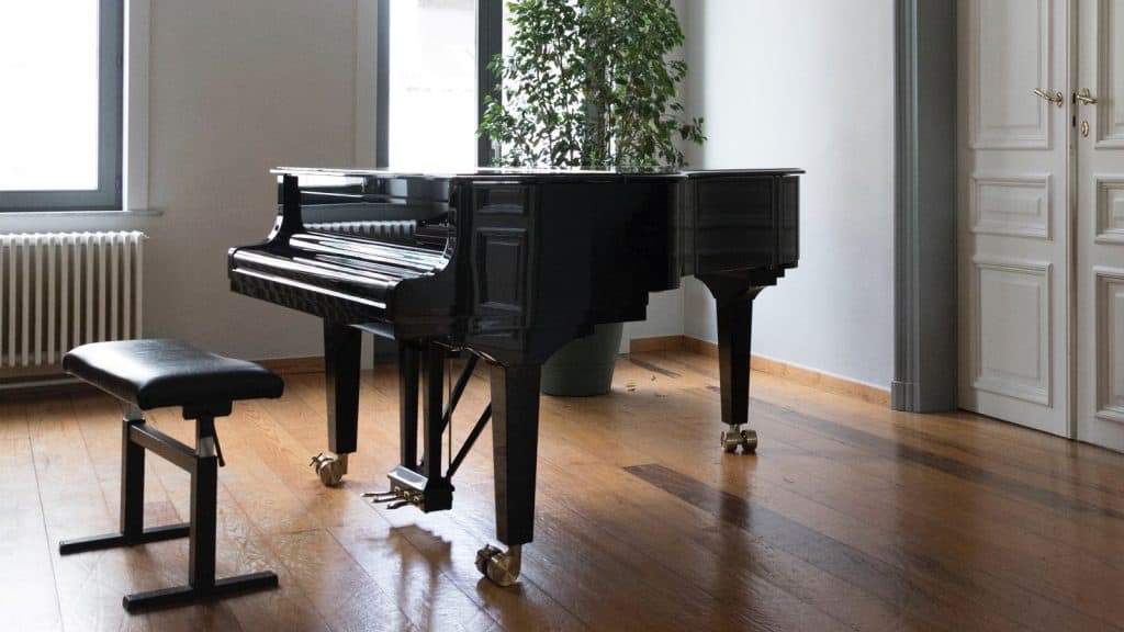 A grand piano in a period apartment (Image Source: Jean Philippe Delberghe / www.unsplash.com)